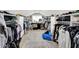 Large walk-in closet with custom shelving, ample storage, and natural light at 7255 Haverhill Ct, Indianapolis, IN 46250