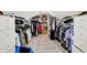 Bright walk-in closet with custom shelving for clothing and accessories at 7255 Haverhill Ct, Indianapolis, IN 46250