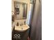 Bathroom features a modern vanity, faucet, and a shower curtain at 7504 N Green Meadows, Fairland, IN 46126