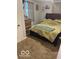 Bedroom features a window, dresser, soft lighting, and comfortable bed at 7504 N Green Meadows, Fairland, IN 46126
