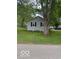 Single-story home with gray siding and mature trees in a spacious yard at 7504 N Green Meadows, Fairland, IN 46126