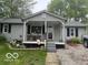 Charming single-story home with gray siding and welcoming front porch at 7504 N Green Meadows, Fairland, IN 46126