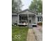 Charming single-story home with gray siding and welcoming front porch at 7504 N Green Meadows, Fairland, IN 46126