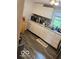 Modern kitchen featuring white cabinets, granite countertops, and stylish backsplash at 7504 N Green Meadows, Fairland, IN 46126