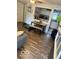 Cozy living area with hardwood floors and a glimpse into the modern kitchen at 7504 N Green Meadows, Fairland, IN 46126