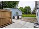 View of backyard with shed, doghouse, and stone steps leading to grassy area at 7536 Mccord St, McCordsville, IN 46055