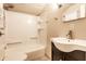 Well-lit bathroom featuring a shower and tub combo and a sink with vanity at 7536 Mccord St, McCordsville, IN 46055