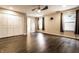 Spacious bedroom features a ceiling fan, wood floors, and neutral color scheme at 7536 Mccord St, McCordsville, IN 46055