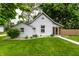 Charming home with gray siding, lush green lawn, and a welcoming walkway leading to a screened-in porch at 7536 Mccord St, McCordsville, IN 46055
