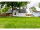 Grassy front yard leading up to house and detached garage with fenced yard at 7536 Mccord St, McCordsville, IN 46055