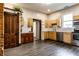 Open kitchen with stainless steel appliances, wooden cabinets, and ample counter space at 7536 Mccord St, McCordsville, IN 46055
