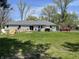 Spacious backyard with a patio area, grill, and a lawn perfect for outdoor activities at 7731 Scarborough S Blvd, Indianapolis, IN 46256
