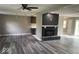 Open-concept living room with modern floors, a sleek fireplace, and plenty of natural light at 7731 Scarborough S Blvd, Indianapolis, IN 46256