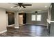 Inviting living room features contemporary flooring, fresh paint, and an open layout with natural light at 7731 Scarborough S Blvd, Indianapolis, IN 46256