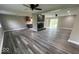 Spacious living room showcases modern floors, an open layout, a fireplace, and sliding glass doors at 7731 Scarborough S Blvd, Indianapolis, IN 46256