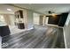 Open-concept living space adjacent to the kitchen, with modern flooring and ample natural light at 7731 Scarborough S Blvd, Indianapolis, IN 46256