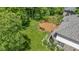 Aerial view of a home with a large deck and beautiful backyard nestled among mature trees at 7744 Preservation Dr, Indianapolis, IN 46278