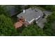Aerial view showcasing the multi-tiered deck and verdant tree coverage on the property at 7744 Preservation Dr, Indianapolis, IN 46278