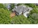 Aerial shot showcasing the house's deck, backyard, and lush surrounding landscape at 7744 Preservation Dr, Indianapolis, IN 46278