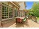 Exterior view of the wooden deck with outdoor dining area, connected to the home's exterior at 7744 Preservation Dr, Indianapolis, IN 46278