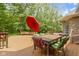 Wooden deck with outdoor dining area, umbrella, and surrounded by mature trees and greenery at 7744 Preservation Dr, Indianapolis, IN 46278