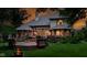 Inviting backyard with a spacious deck, fire pit, and lush green lawn at 7744 Preservation Dr, Indianapolis, IN 46278
