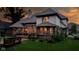 Exterior view of a well-lit deck and patio area, perfect for outdoor entertaining at 7744 Preservation Dr, Indianapolis, IN 46278