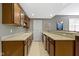 Basement wet bar includes wood cabinets, countertop space, sink, and beverage refrigerator at 7744 Preservation Dr, Indianapolis, IN 46278