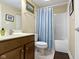 Clean bathroom with tub/shower combination, vanity with storage, and neutral color scheme at 7744 Preservation Dr, Indianapolis, IN 46278