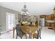 Dining nook featuring views into kitchen with center island at 7744 Preservation Dr, Indianapolis, IN 46278