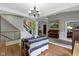 Inviting dining room leads to a staircase and features a decorative chandelier at 7744 Preservation Dr, Indianapolis, IN 46278