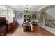 Dining room featuring hardwood floors, chandelier, and view of the staircase at 7744 Preservation Dr, Indianapolis, IN 46278