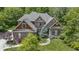 Attractive brick home with mature trees and a beautifully landscaped front yard at 7744 Preservation Dr, Indianapolis, IN 46278