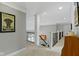 Upstairs hallway with carpet, staircase, and natural light at 7744 Preservation Dr, Indianapolis, IN 46278