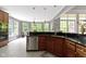 Bright kitchen features wood cabinetry, granite counters, stainless appliances, and a lovely bay window at 7744 Preservation Dr, Indianapolis, IN 46278