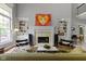 Bright living room features a fireplace, built-in bookshelves, and hardwood floors at 7744 Preservation Dr, Indianapolis, IN 46278