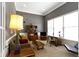 Cozy living room with a comfortable sofa, vintage furniture, and bright natural light at 7744 Preservation Dr, Indianapolis, IN 46278