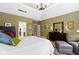This main bedroom has hardwood floors, neutral walls, and plenty of natural light at 7744 Preservation Dr, Indianapolis, IN 46278