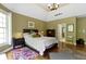 A main bedroom with hardwood floors, neutral walls, and ample natural light at 7744 Preservation Dr, Indianapolis, IN 46278
