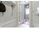 Mudroom with storage bench, coat hooks, and access to the front door at 7744 Preservation Dr, Indianapolis, IN 46278
