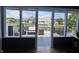 Back porch featuring outdoor seating area with peaceful views of a nearby lake at 7838 Chesapeake E Dr, Indianapolis, IN 46236
