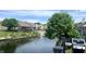 Scenic backyard view of lake and surrounding houses at 7838 Chesapeake E Dr, Indianapolis, IN 46236