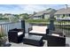 Backyard view of furniture on the deck overlooking the lake at 7838 Chesapeake E Dr, Indianapolis, IN 46236