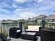 Backyard view of furniture on the deck overlooking the lake at 7838 Chesapeake E Dr, Indianapolis, IN 46236