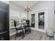 Bright breakfast nook featuring a glass table, natural light, and access to the outdoors at 7838 Chesapeake E Dr, Indianapolis, IN 46236