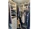 Organized walk-in closet featuring built-in shelving and drawers for efficient storage of clothes and accessories at 7838 Chesapeake E Dr, Indianapolis, IN 46236