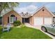 Charming brick home featuring an attached garage, well-kept lawn, and inviting front yard at 7838 Chesapeake E Dr, Indianapolis, IN 46236