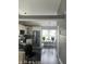 Modern kitchen featuring white cabinets, sleek black countertops, and stainless steel appliances at 7838 Chesapeake E Dr, Indianapolis, IN 46236