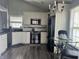 Charming kitchen showcasing white cabinets, stainless steel appliances, and an elegant dining area at 7838 Chesapeake E Dr, Indianapolis, IN 46236