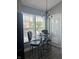 Bright kitchen nook featuring a glass table, stylish chairs, and a modern chandelier at 7838 Chesapeake E Dr, Indianapolis, IN 46236